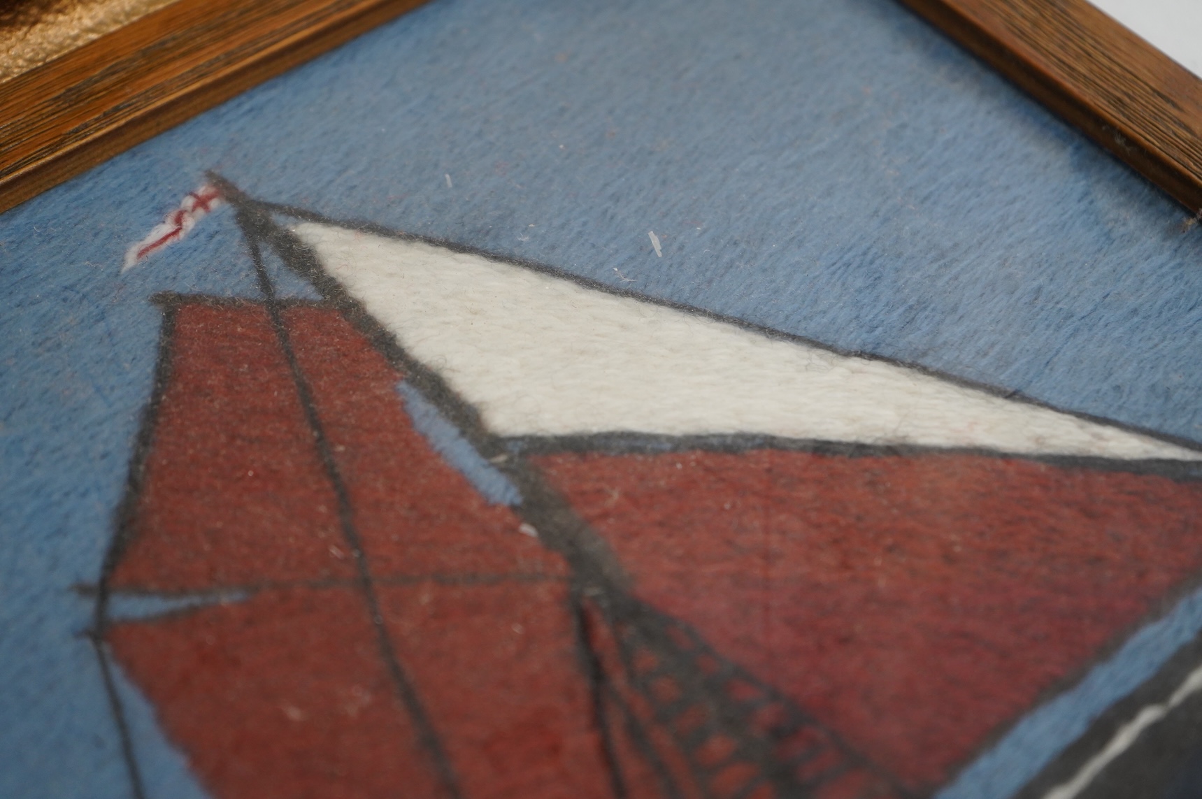 Two 20th century wool worked galleon embroideries and two similar yachting wool works, largest in decorative frame 36cm x 29cm